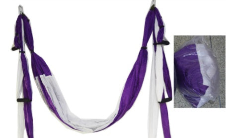 Purple and white yoga swing hammock with hanging fabric loops