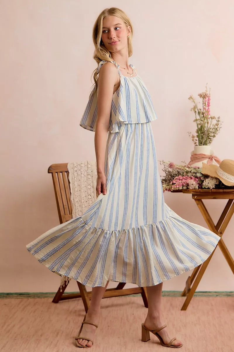 Sleeveless striped midi dress with tiered ruffles, shoulder ties, and lined skirt
