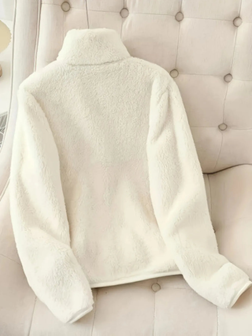 White fleece zip-up jacket back view with stand collar