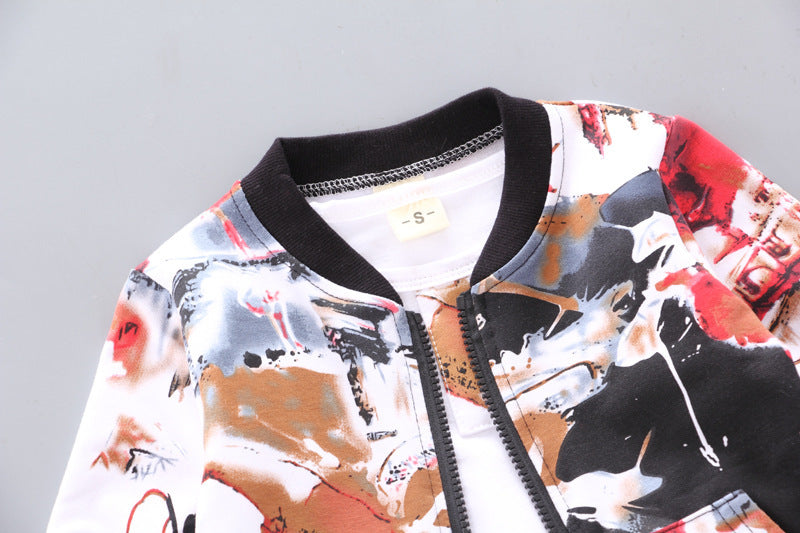 Close-up of boys' jacket collar, zipper, and abstract print