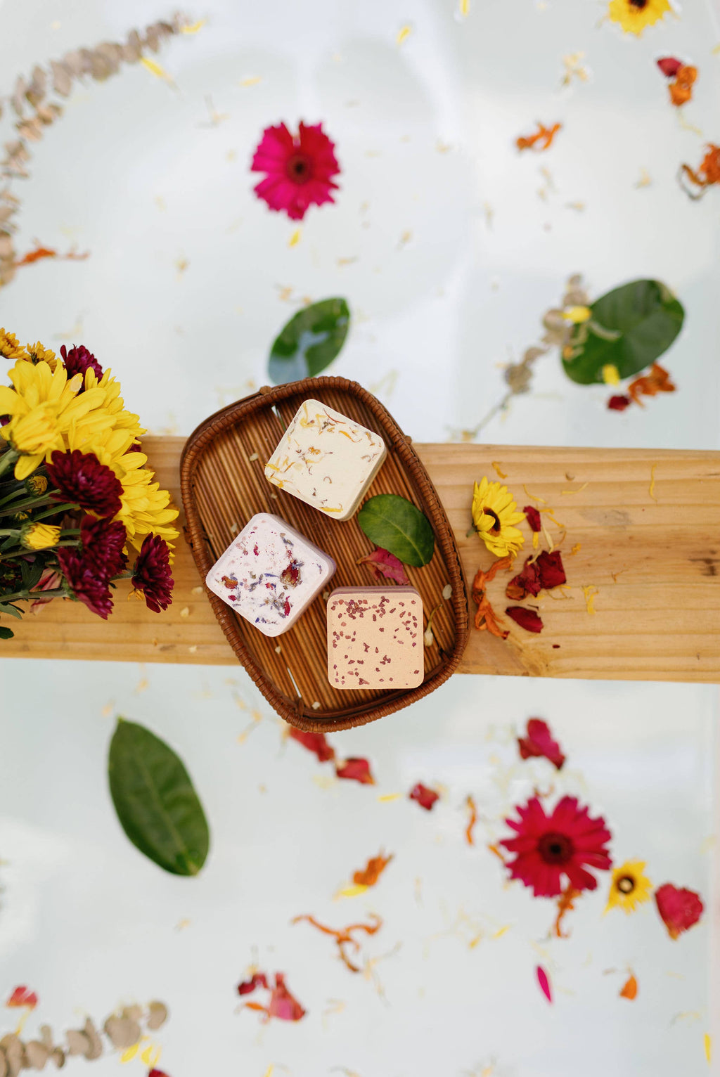 Set of square bath bombs in a wooden tray, white cubes with dried flower toppings