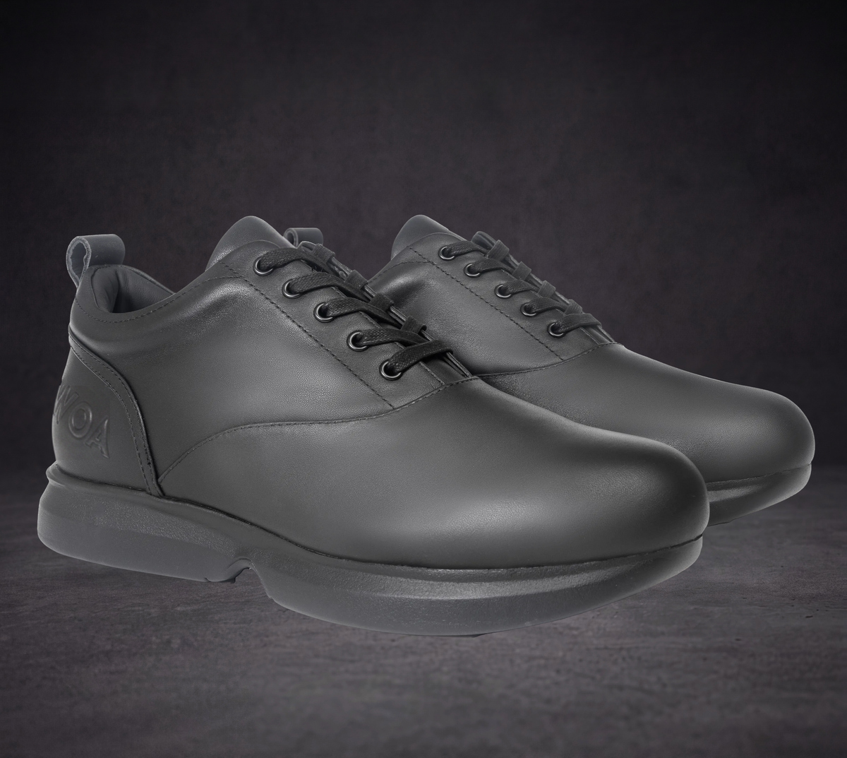 Pair of WOA low-top lace-up sneakers in dark leather with padded collar