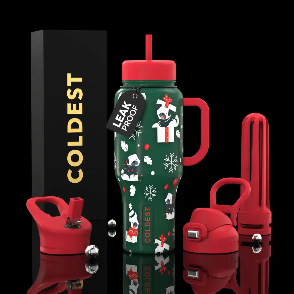 36oz insulated water bottle with green straw lid and penguin snowflake pattern