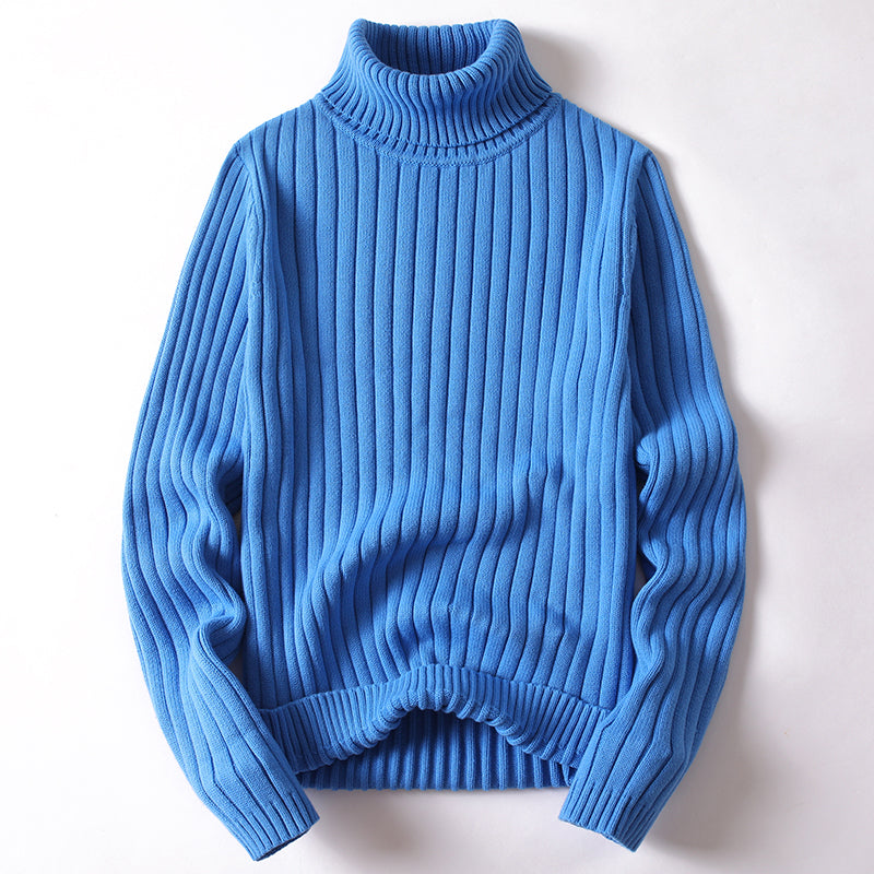 Blue ribbed turtleneck sweater with long sleeves and ribbed knit hem.