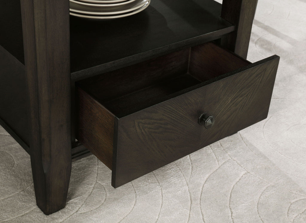 Dark cocoa wood drawer front with metal pull under the table