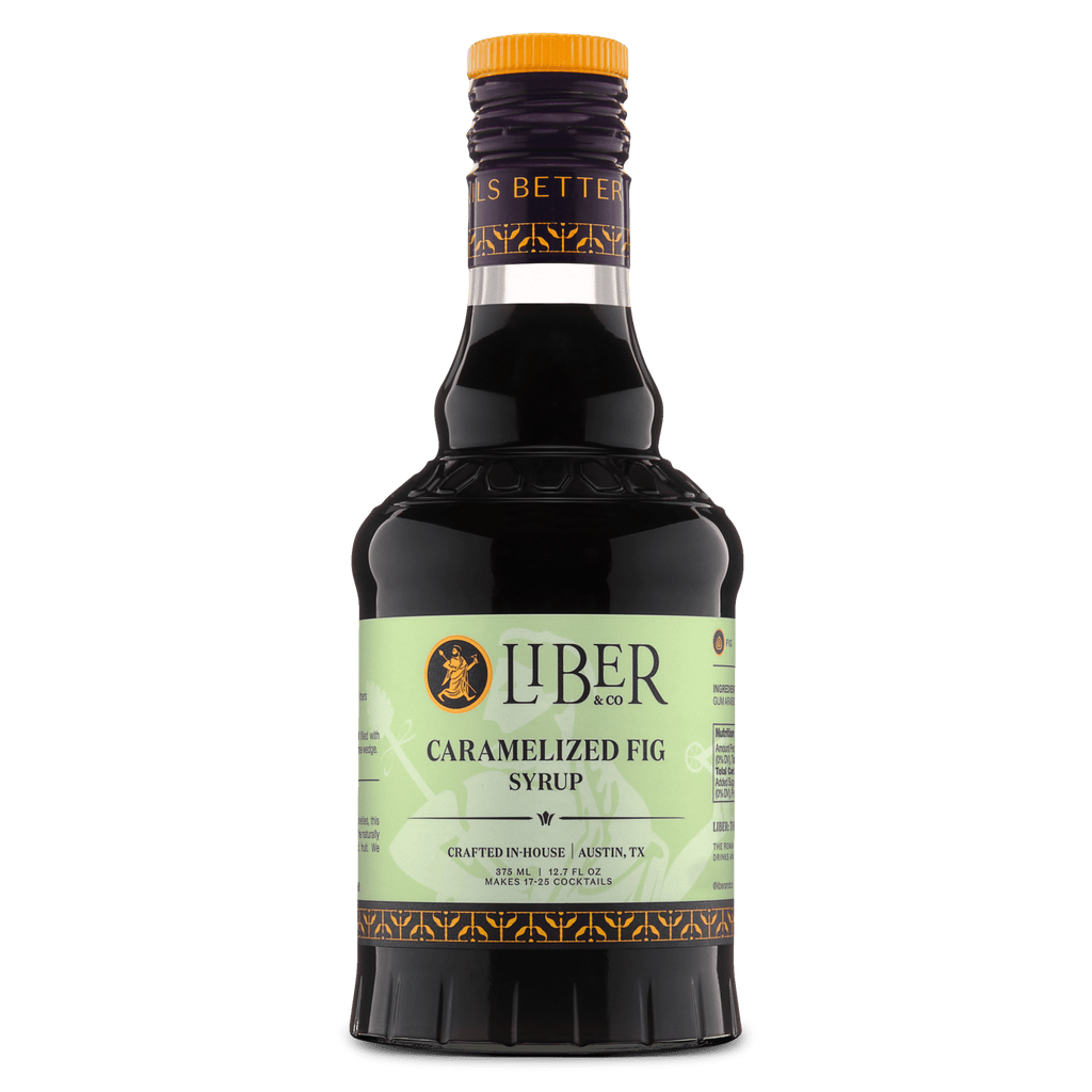 Caramelized fig syrup bottle with amber cap and dark glass body, front label visible