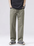 Men's army green drawstring cargo pants with side pockets and cuffed hems.