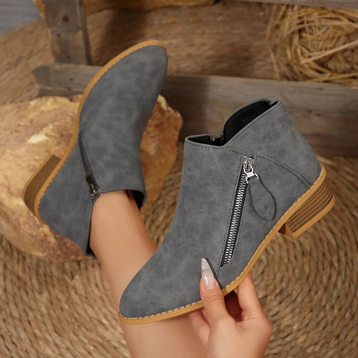 Dark gray suede ankle boots with side zipper, block heel, tan outsole