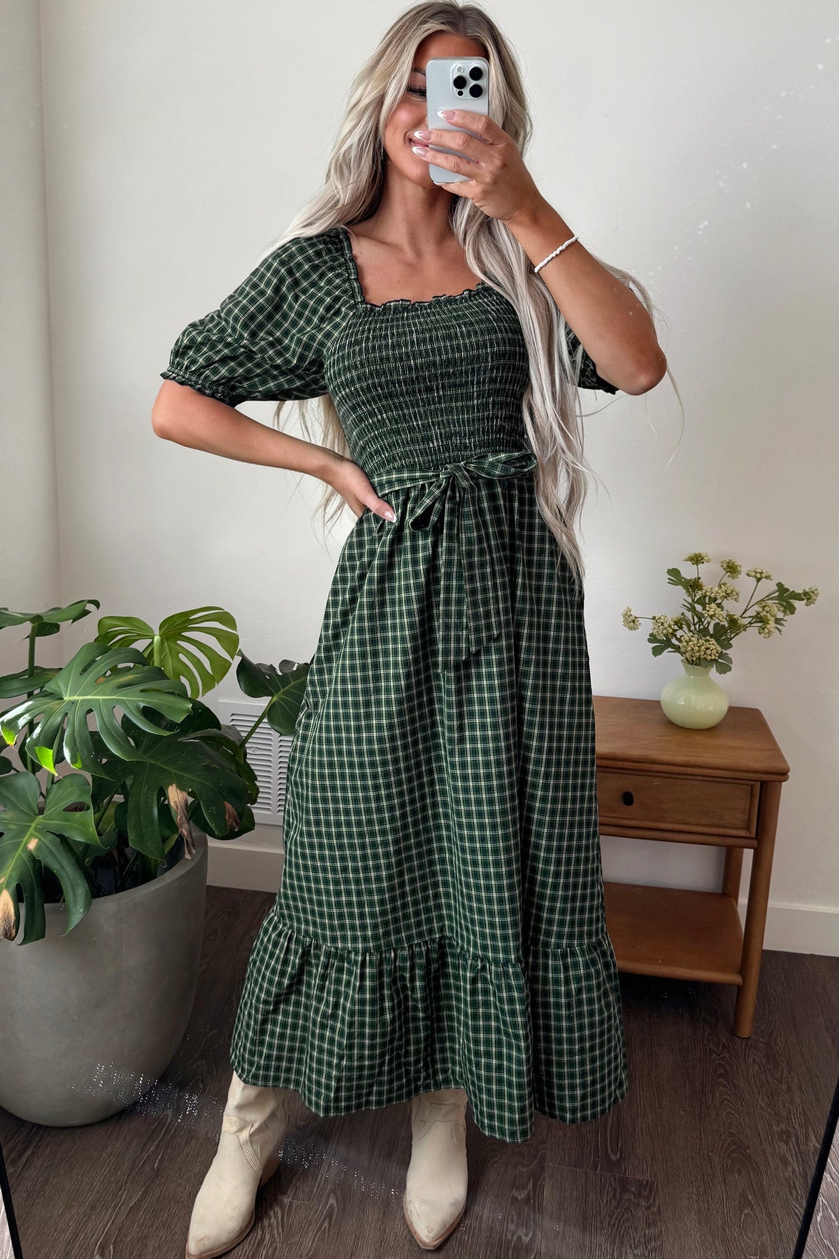 Dark green plaid square-neck shirred waist dress with puff sleeves and tiered ruffle hem.