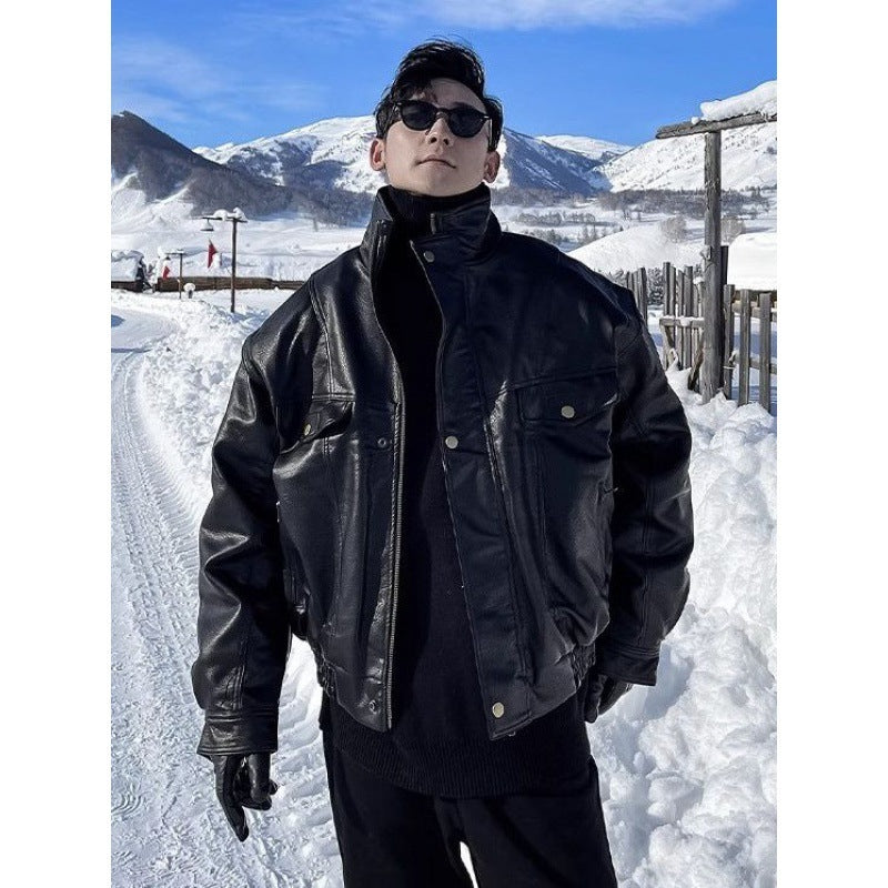 Men's black leather jacket with stand collar, snap front, and flap chest pockets