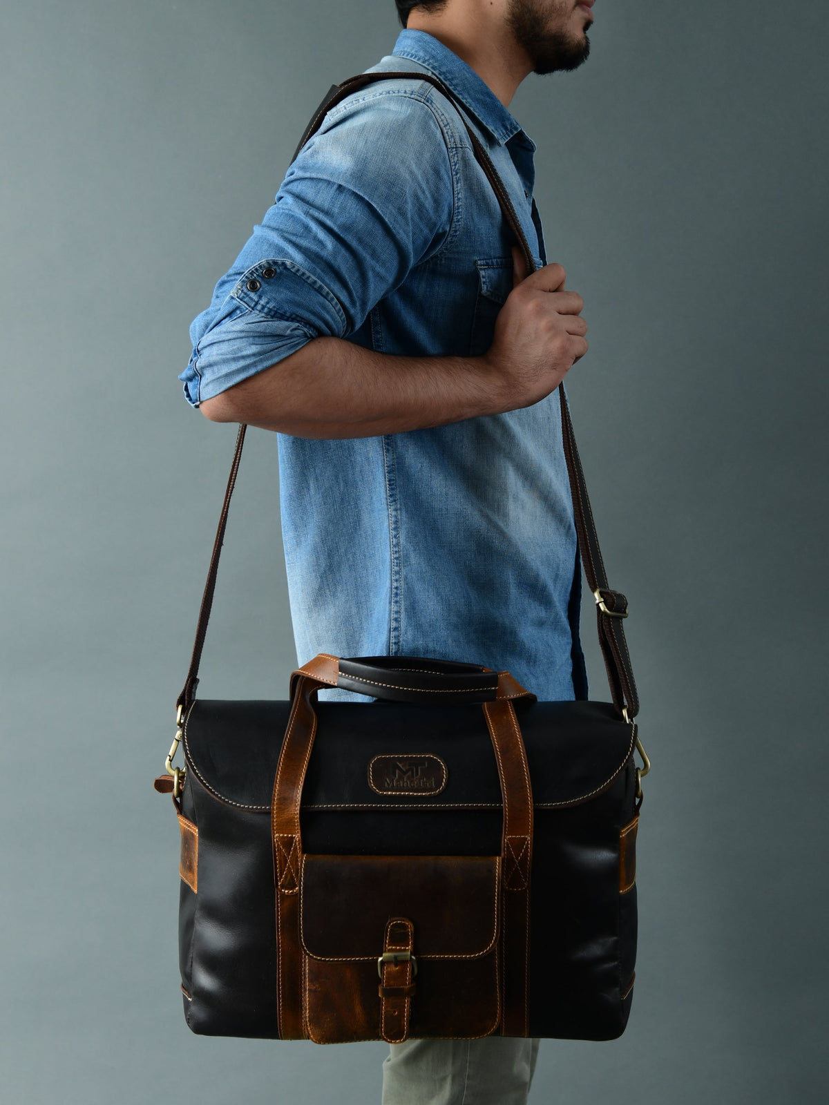 Black-brown leather messenger briefcase bag with top handle and shoulder straps
