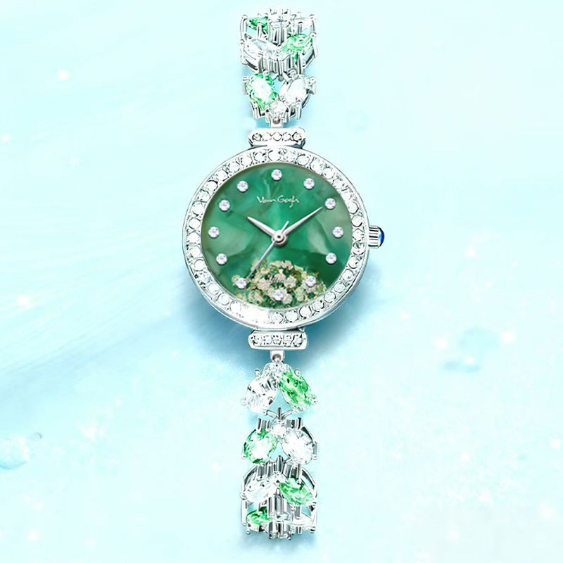 Green floral face wristwatch with silver rhinestone details and green stone accents