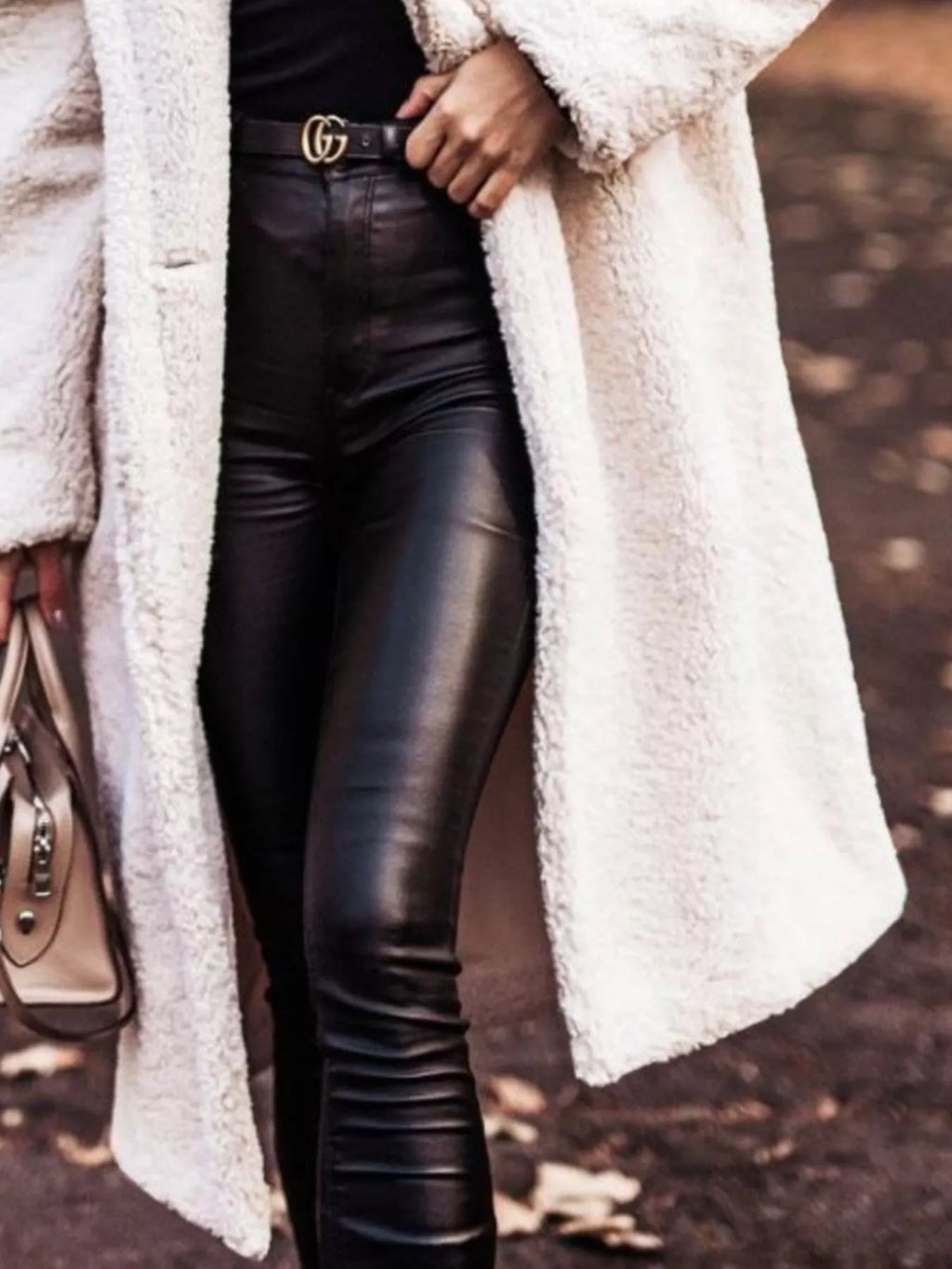 White hooded teddy longline coat, open front, textured fleece over dark leggings.