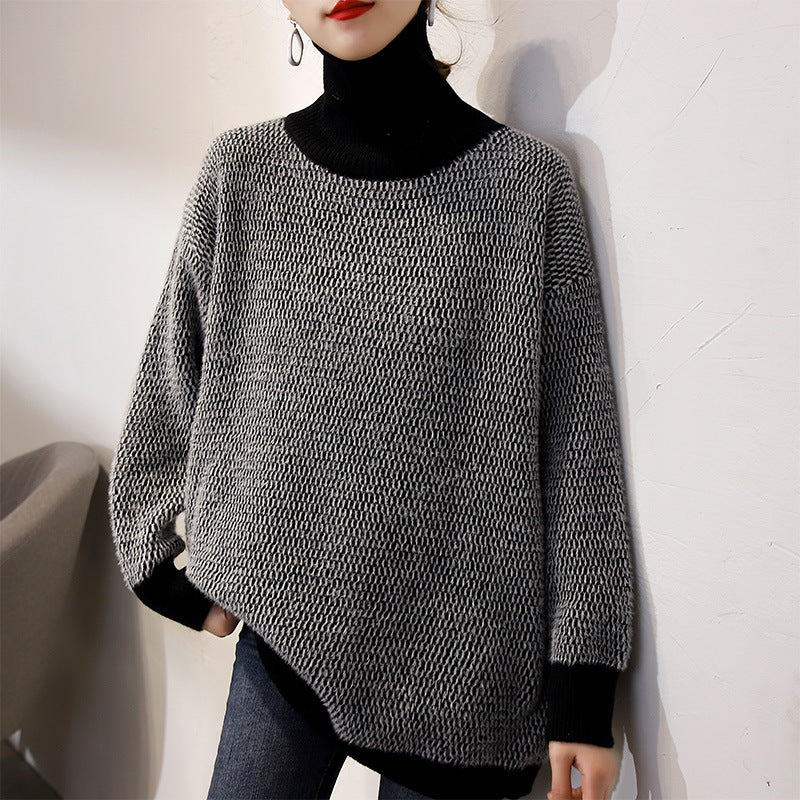 Women’s knit turtleneck sweater in dark charcoal, loose fit with ribbed cuffs and hem.