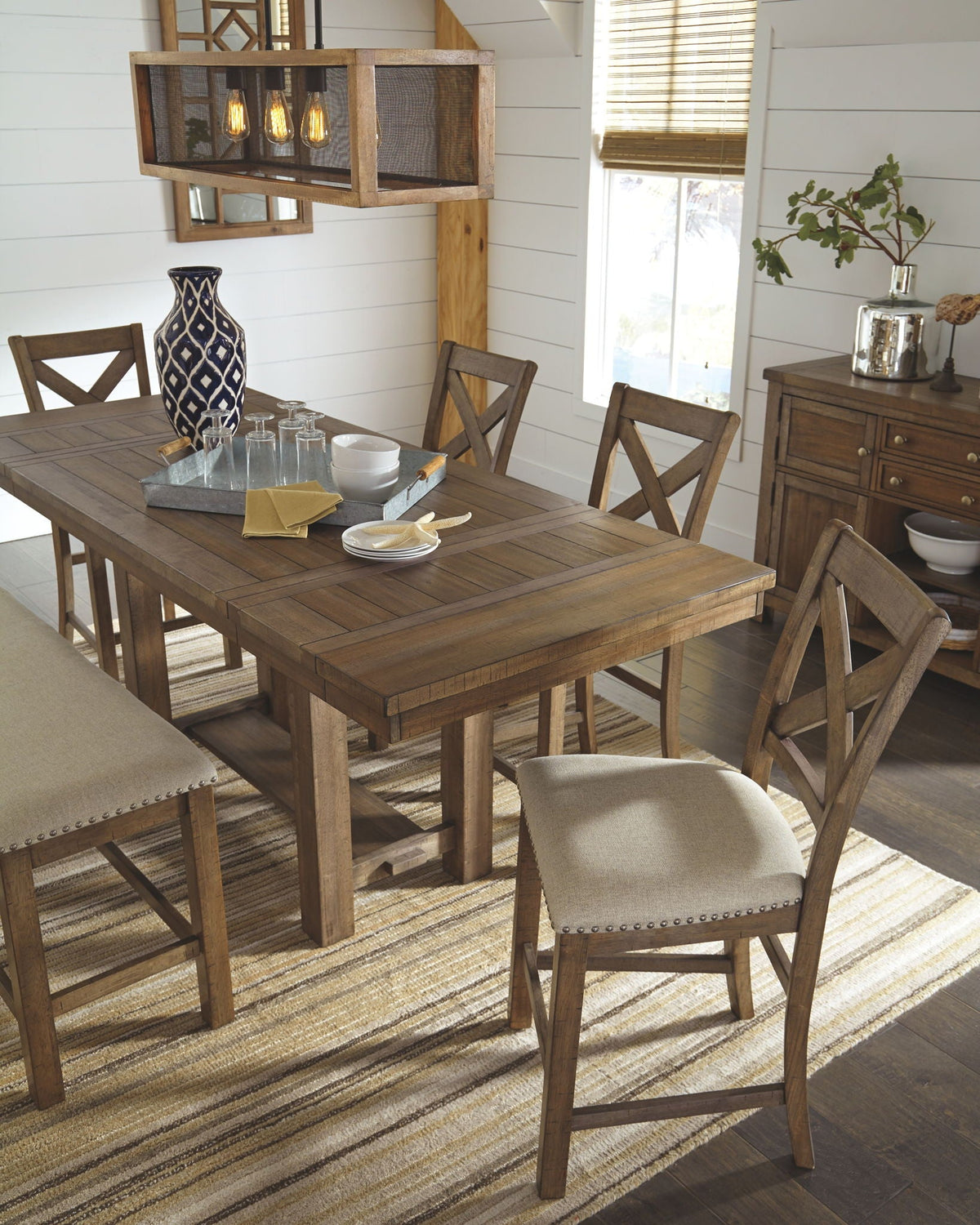Dark brown rectangular dining table with upholstered bar stools