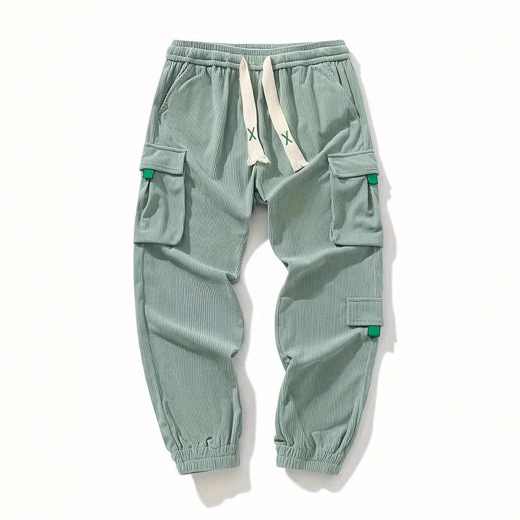 Light green corduroy work pants with ankle cuffs and drawstring waist