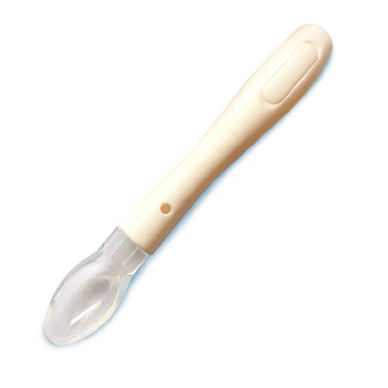 Infant silicone soft-tip spoon with soft transparent tip, milky yellow handle
