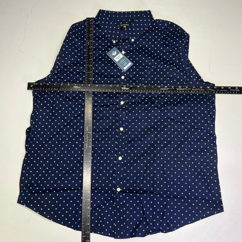 Men's navy button-up shirt folded with small white dot pattern and attached hang tag