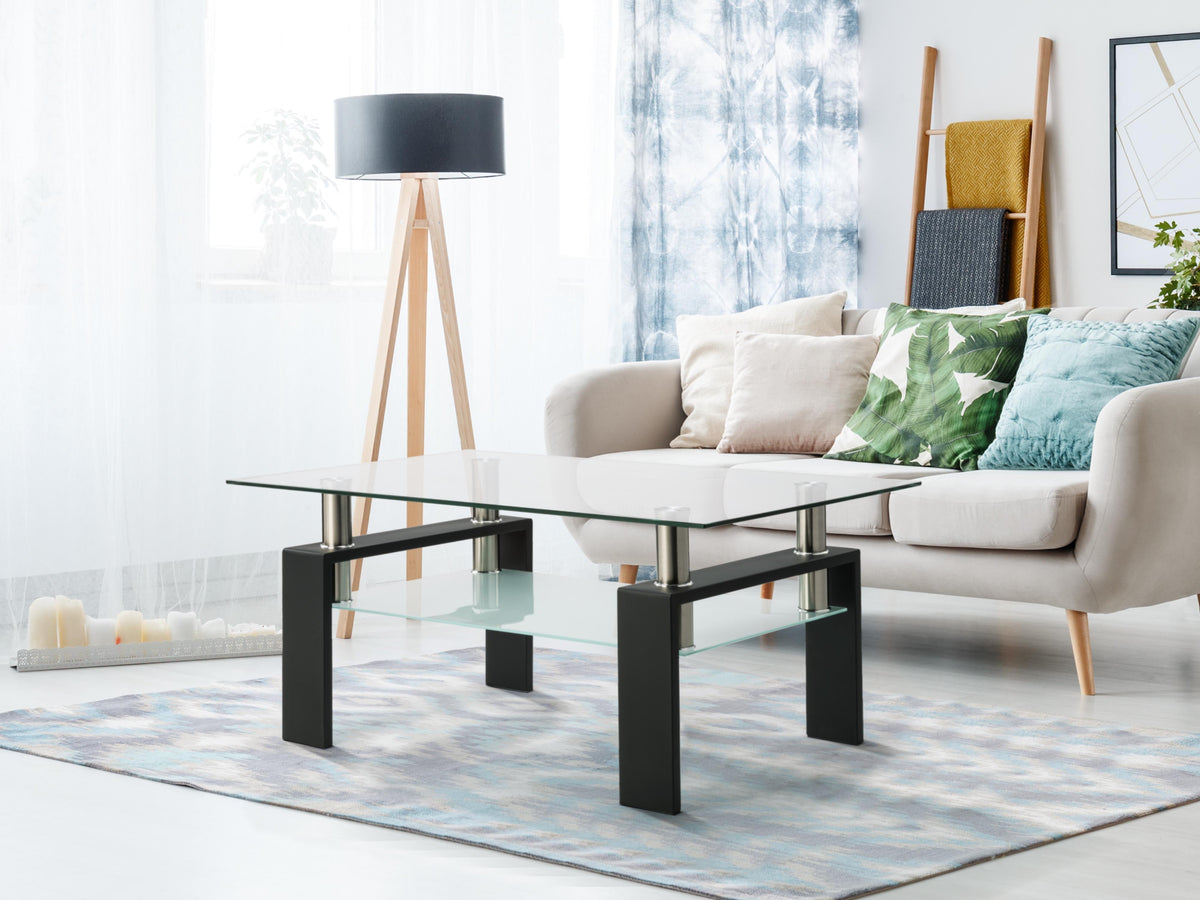 Rectangular black glass coffee table with clear top, lower shelf, and four posts