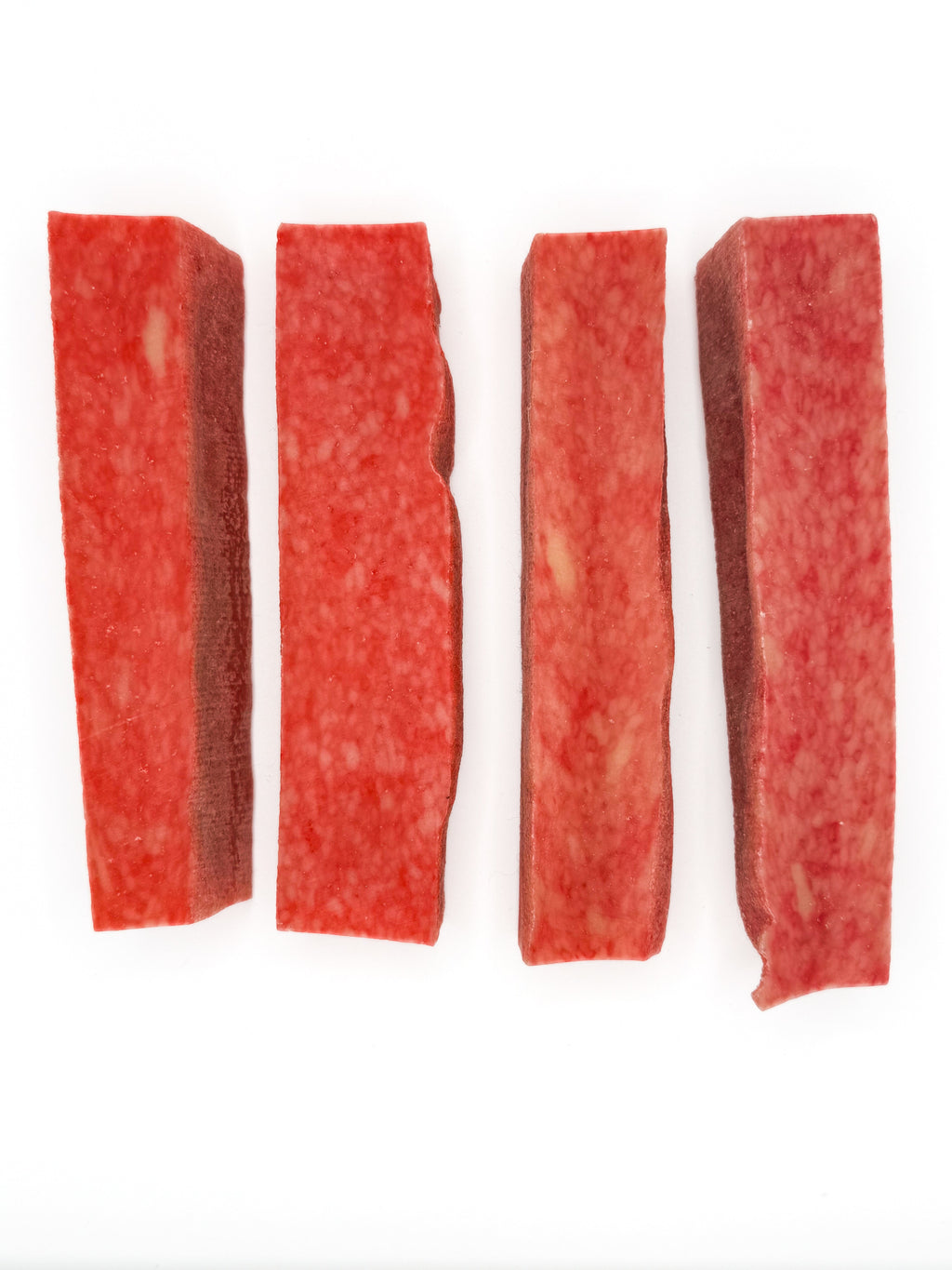 Set of four red yak cheese chew strips, textured surface
