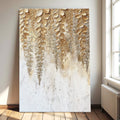 Gold and white botanical wall art canvas with raised leaf-like texture and dripping accents