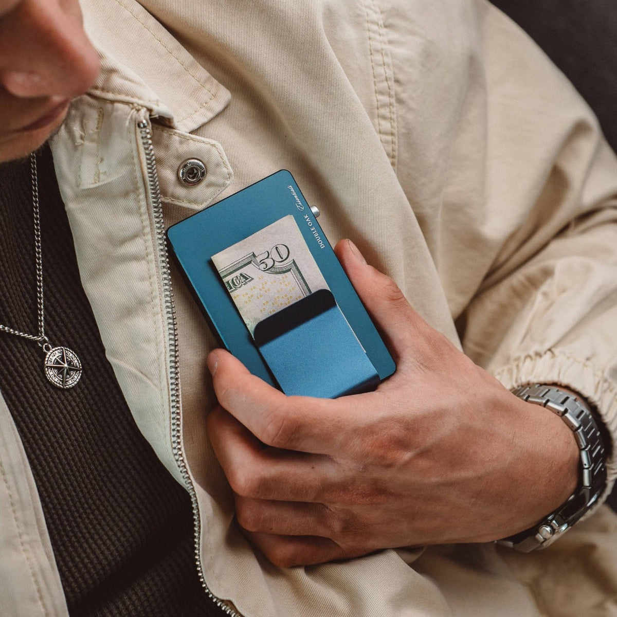 Blue pop-up cardholder inserted with a payment card, front window visible.