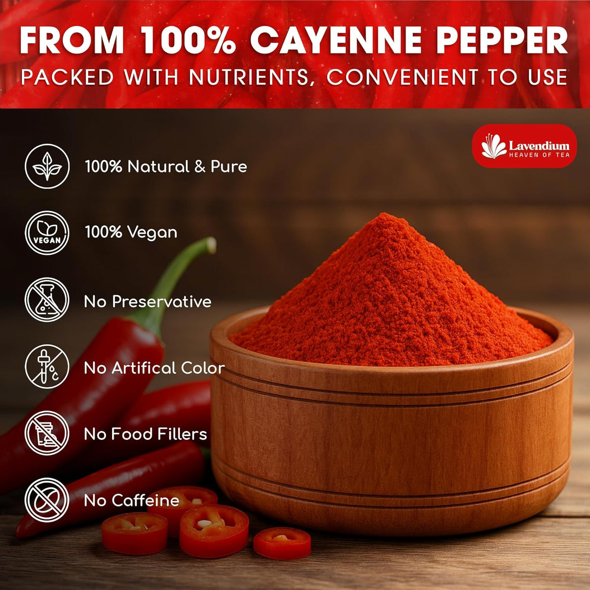 Wooden bowl filled with red cayenne pepper powder with whole red chili peppers