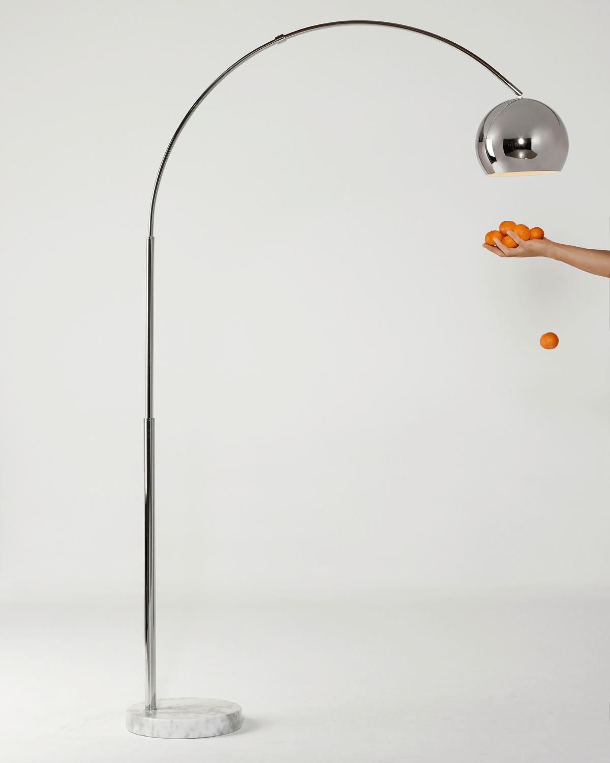 Chrome standing arc lamp with rounded dome shade
