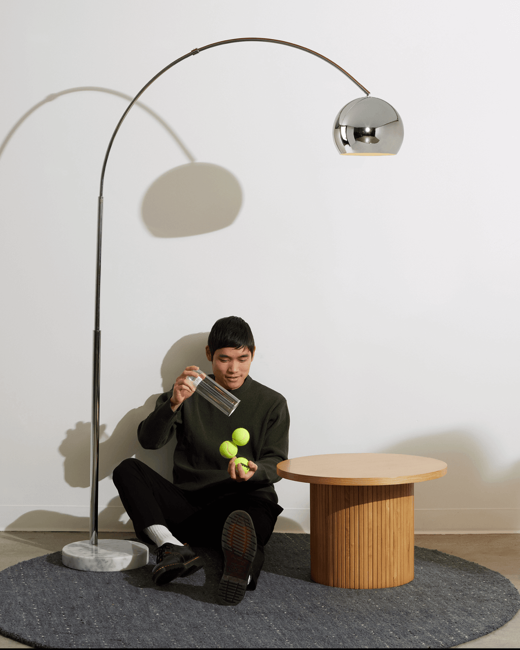 Chrome arc floor lamp with round marble-look base and dome head