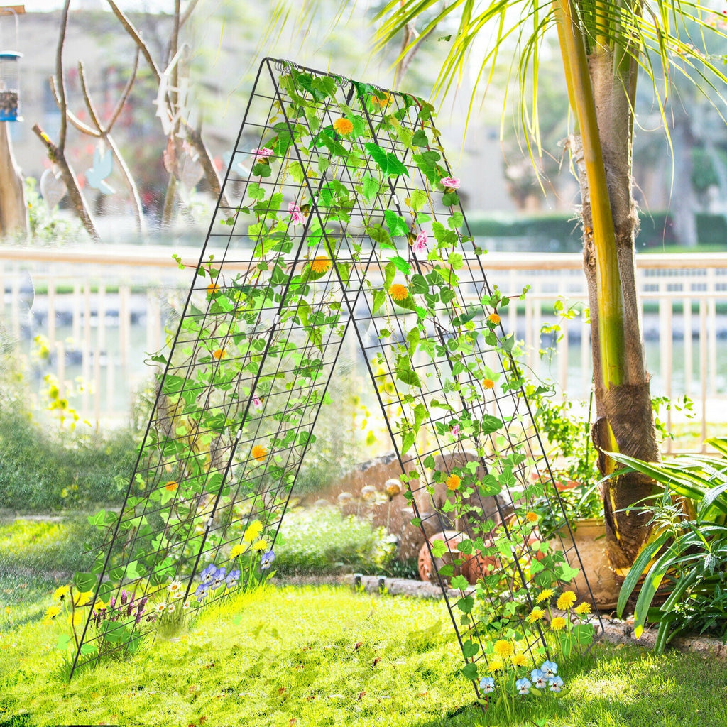 Green foldable A-frame plant trellis with climbing vines and grid panels