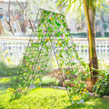 Green foldable A-frame plant trellis with climbing vines and grid panels