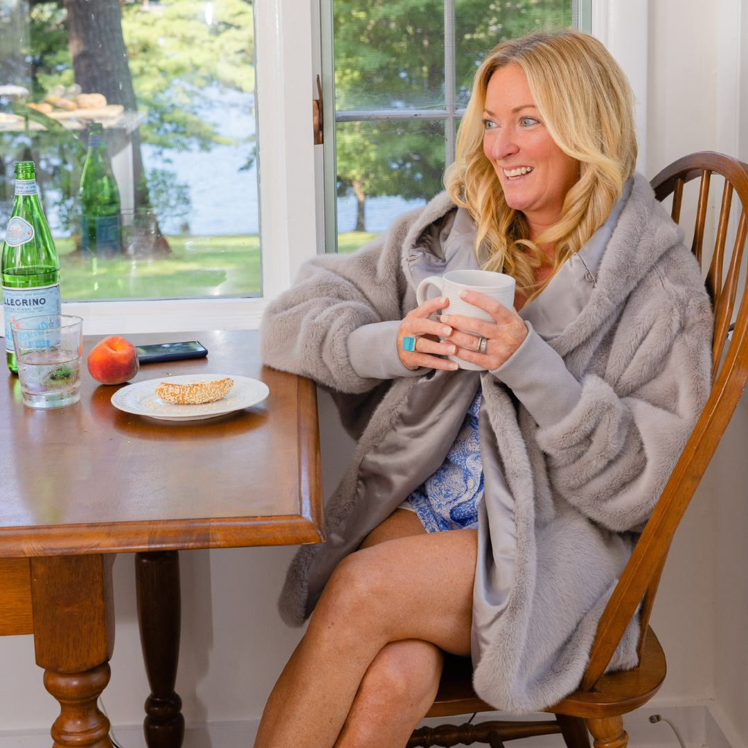 Grey waterproof cardigan with large hood, zip front, and long sleeves