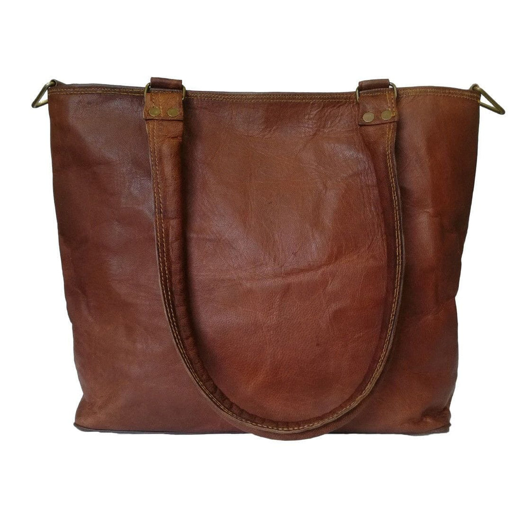 Terry tote bag in brown leather with rounded top, stitched trim, and front zipper pocket