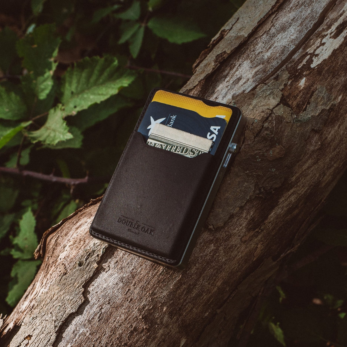 Dark gray leather mod wallet with yellow trim and card in front sleeve