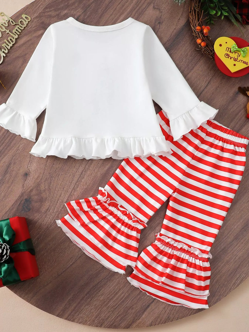 White ruffle-hem Christmas top and red-and-white striped flare pants set