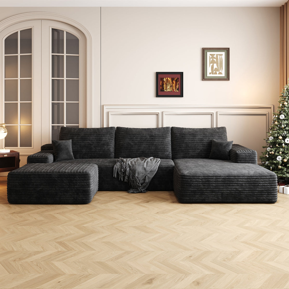 Black sectional sofa with ottoman and chaise, deep cushioned backrest and arm pads