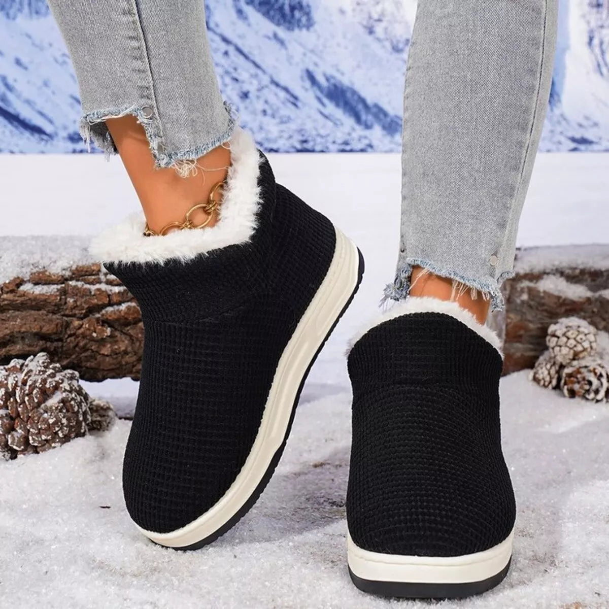 Black knit ankle boots with white plush trim and sidewall platform sole