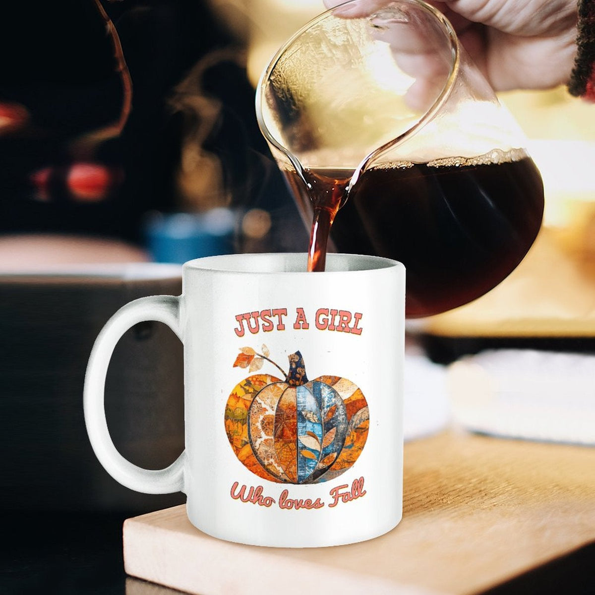 White ceramic mug with handle, orange pumpkin graphic and 'Who loves Fall' text