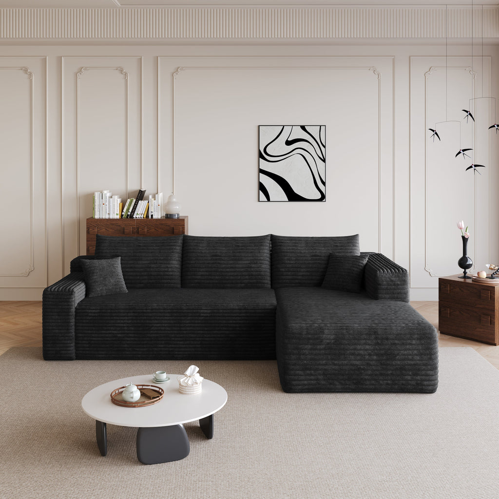 Black L-shaped sectional sofa with chaise and matching back cushions