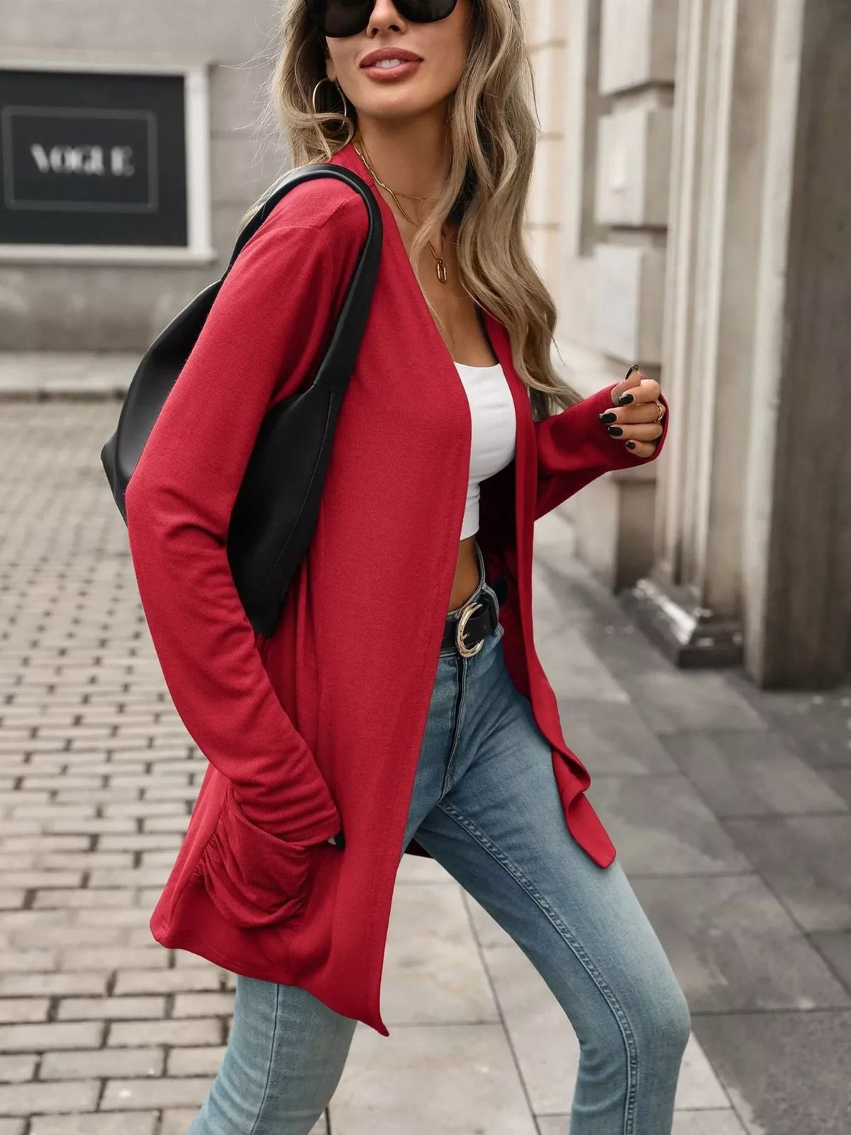 Red open-front cardigan with ruched sleeves and side pockets, draped long fit