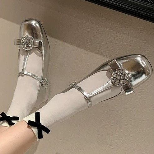 Women’s silver Mary Jane single shoe with rhinestone strap buckles and low heel