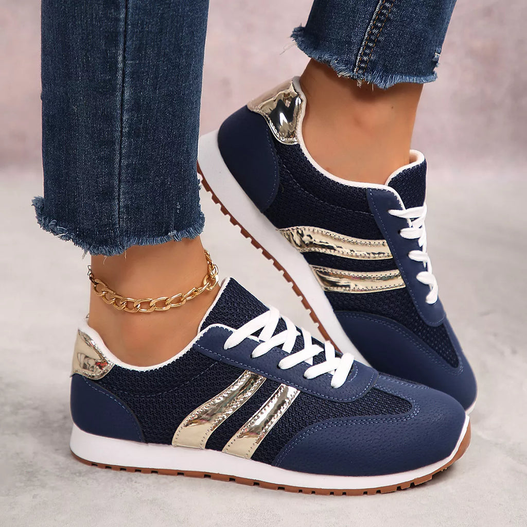 Blue lace-up round toe sneakers with gold-striped side panels and white laces