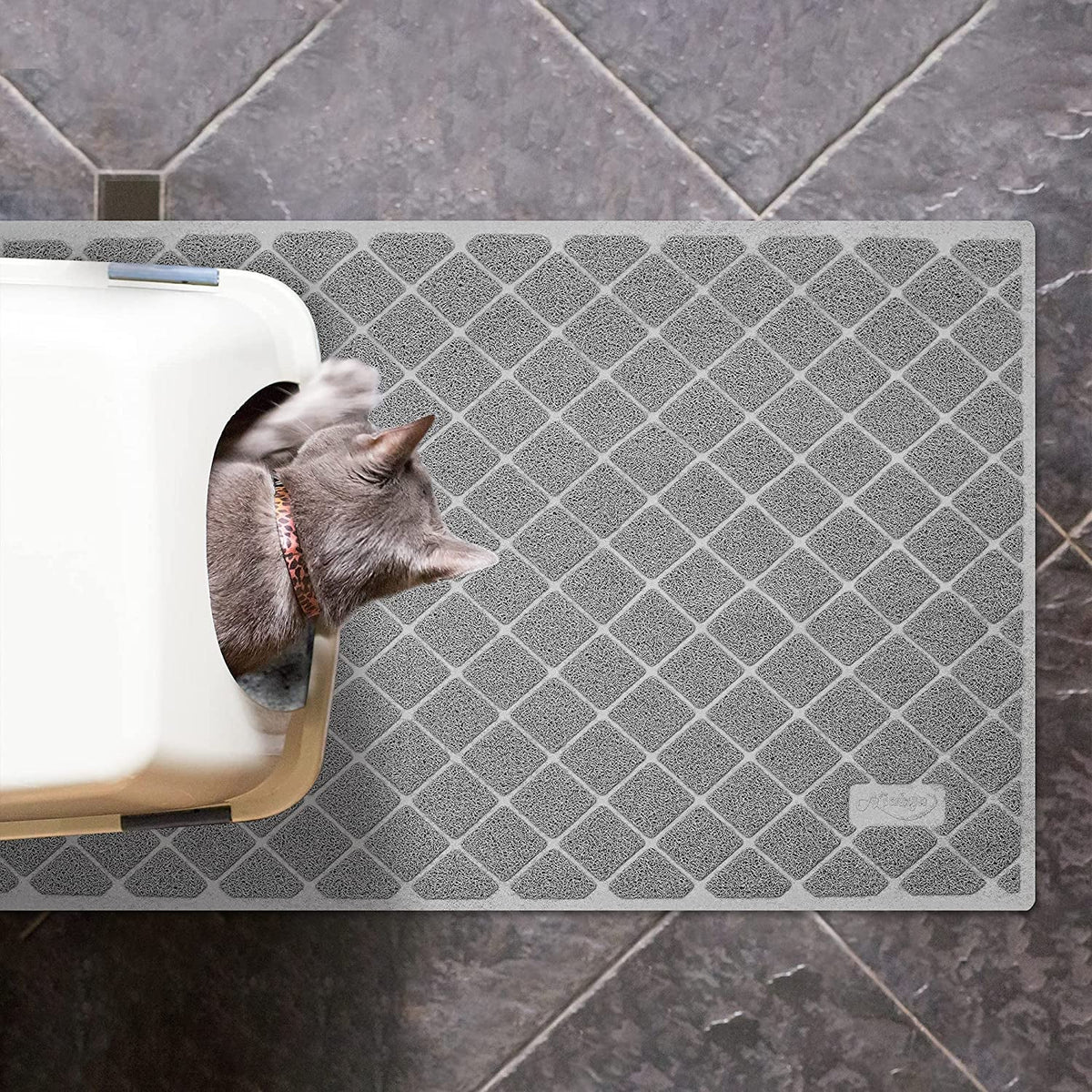 Large gray cat litter mat with a diamond pattern beside a litter box