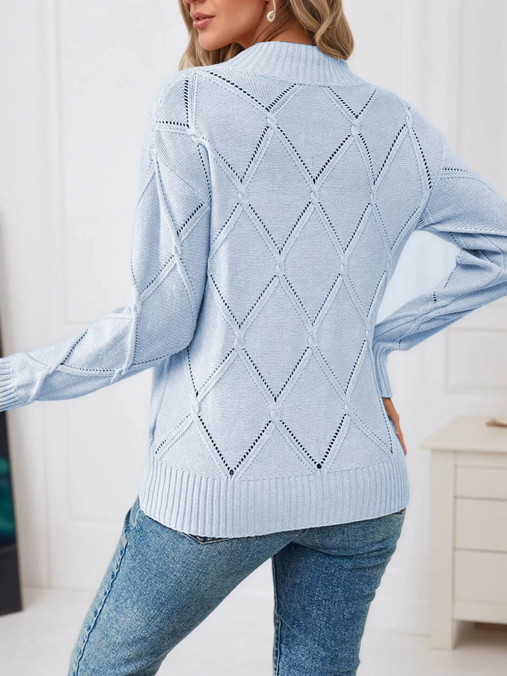 Light blue diamond eyelet knit top, back view with diamond pattern and ribbed cuffs