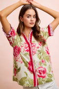 Floral printed woven blouse with coral contrast trim and ruffled sleeves