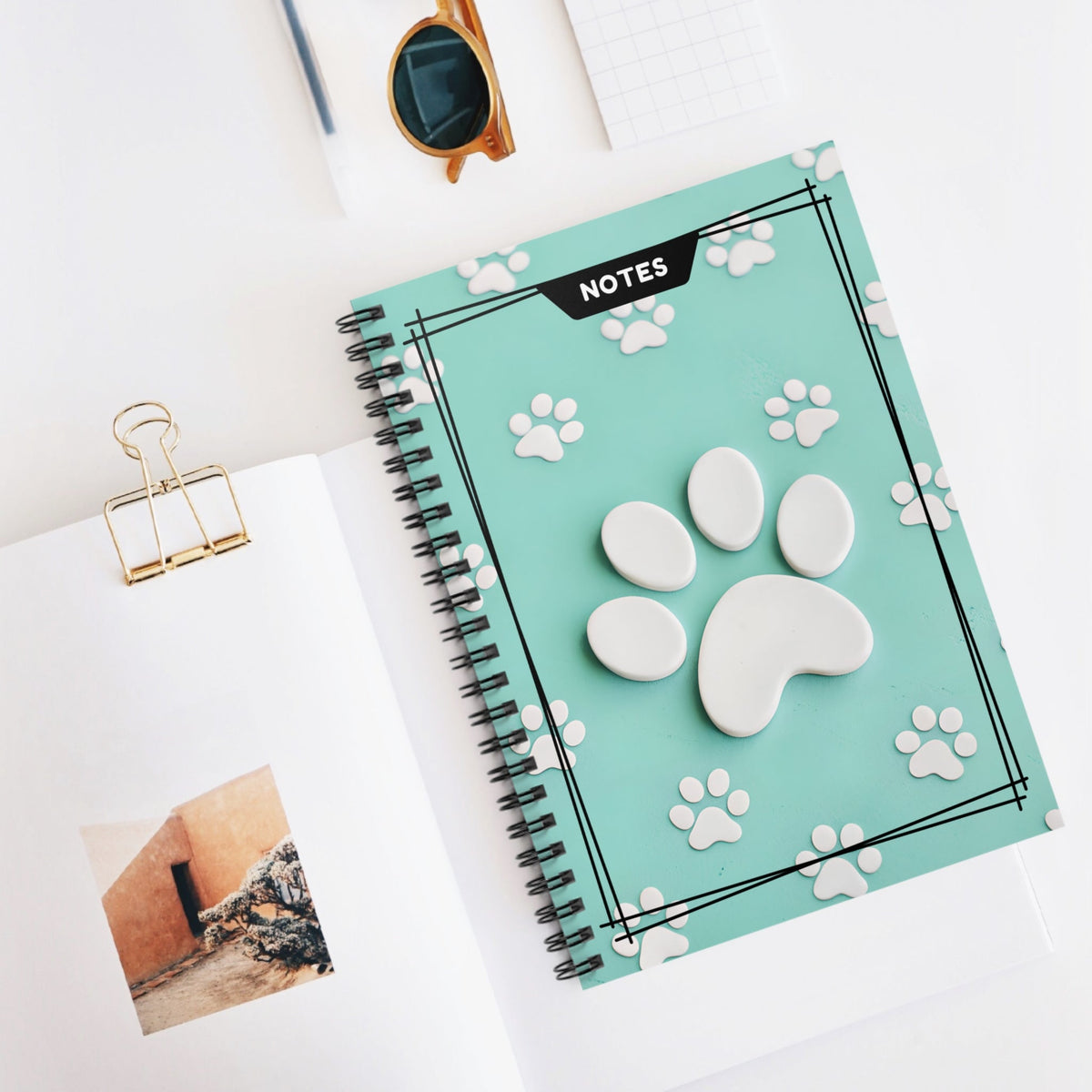 Mint green spiral notebook with 3D cat paw cover and 'NOTES' label