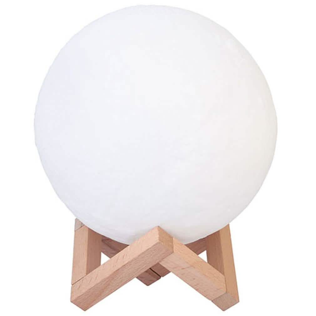 White globe night light on light wood tripod base
