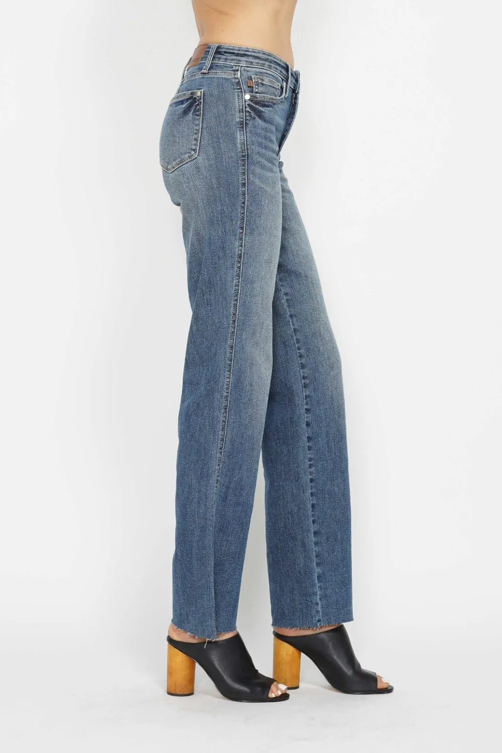 Medium-wash straight-leg jeans, side view with waistband and belt loops