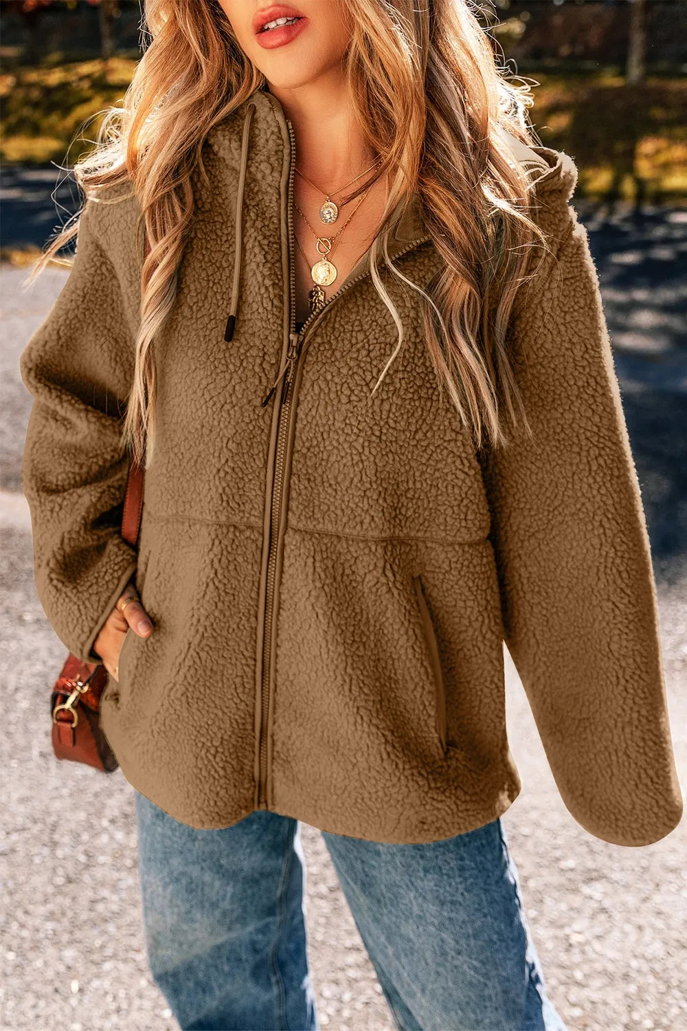 Khaki fleece zip-up hooded jacket with drawstring cord pulls