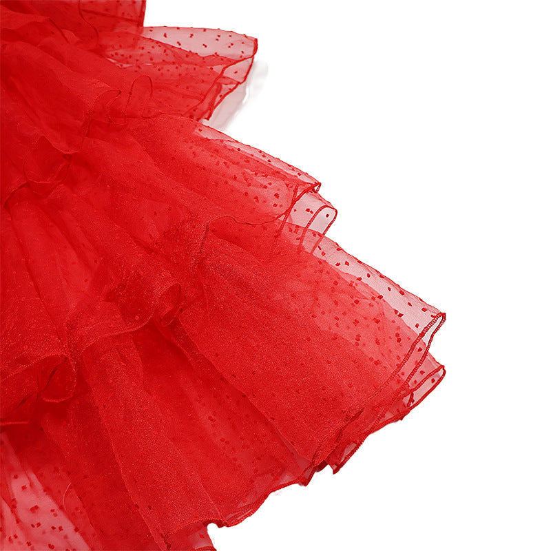 Close-up of red tulle ruffle hem with dotted mesh overlay
